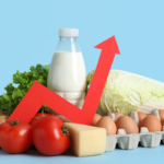 a collection of food items on a light blue background including eggs, milk and vegetables. There is a red arrow across them going up to represent price increases
